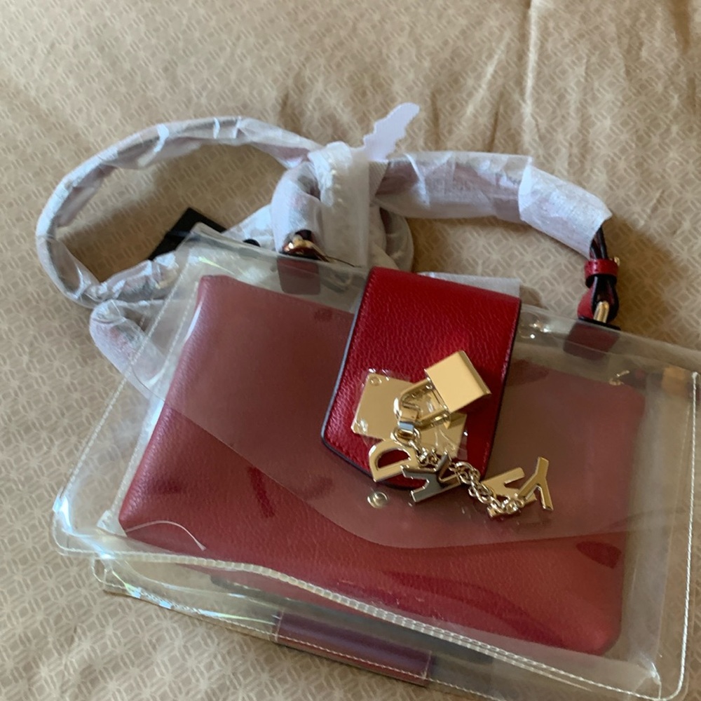 Clear purse with red accents.